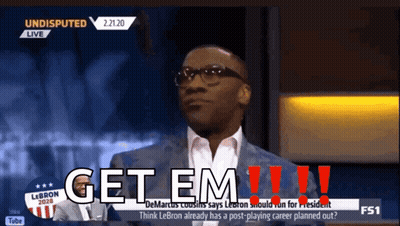 A Man In A Suit Says Get Em !!! GIF