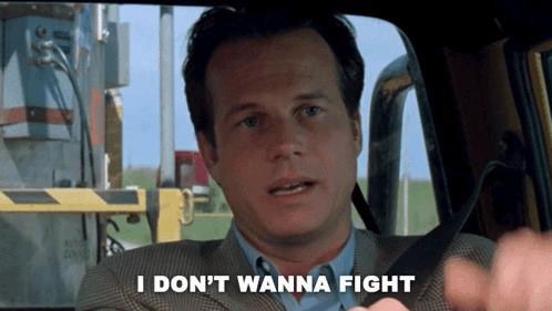 A Man In A Suit Says " I Don T Wanna Fight " GIF