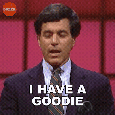 A Man In A Suit Says I Have A Goodie GIF