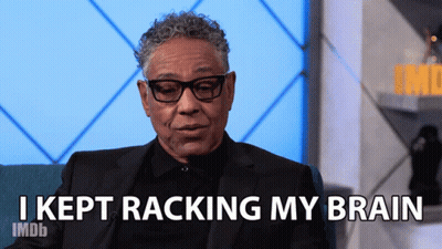 A Man In A Suit Says I Kept Racking My Brain GIF