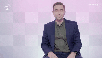 A Man In A Suit Says I 'M A Cancer On A Pink Background GIF