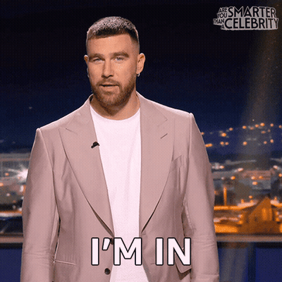 A Man In A Suit Says I 'M In On A Screen GIF