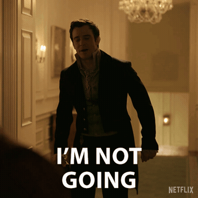 A Man In A Suit Says " I 'M Not Going " While Standing In A Hallway GIF
