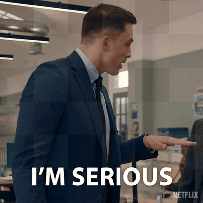 A Man In A Suit Says I 'M Serious While Pointing GIF