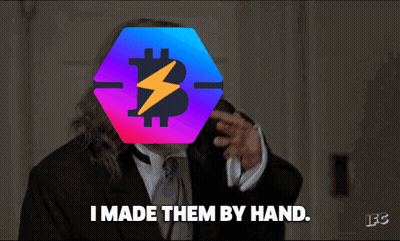 A Man In A Suit Says " I Made Them By Hand " In Front Of A Bitcoin Symbol GIF