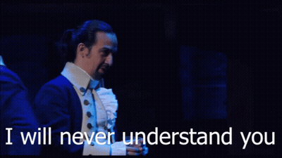 A Man In A Suit Says " I Will Never Understand You " While Standing On A Stage GIF