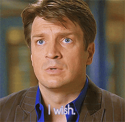 A Man In A Suit Says " I Wish " In Front Of His Face GIF
