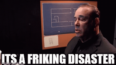 A Man In A Suit Says It 'S A Fricking Disaster In Front Of A Bulletin Board GIF