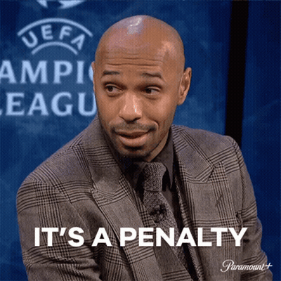 A Man In A Suit Says It 'S A Penalty In Front Of A Uefa Logo GIF