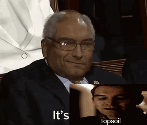 A Man In A Suit Says It 'S Topsoil Next To Another Man 'S Face GIF