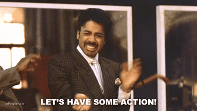 A Man In A Suit Says Let 'S Have Some Action While Dancing GIF