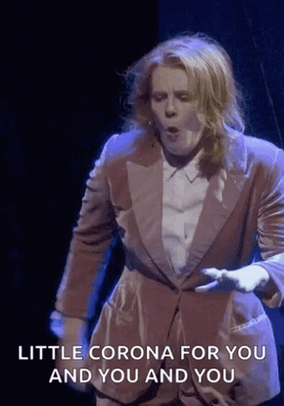 A Man In A Suit Says " Little Corona For You And You And You " GIF