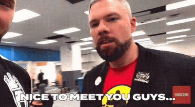 A Man In A Suit Says Nice To Meet You Guys On The Screen GIF