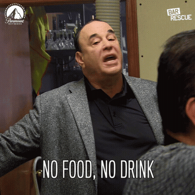 A Man In A Suit Says " No Food No Drink " While Talking To Another Man GIF