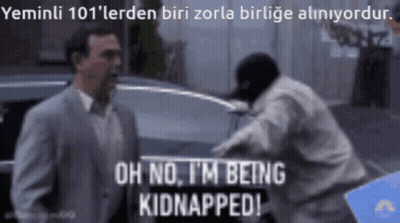 A Man In A Suit Says Oh No I 'M Being Kidnapped In Front Of A Man In A Mask GIF