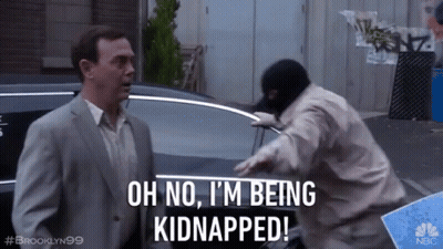 A Man In A Suit Says Oh No I 'M Being Kidnapped In Front Of A Man In A Mask GIF