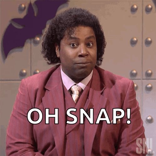 A Man In A Suit Says Oh Snap GIF