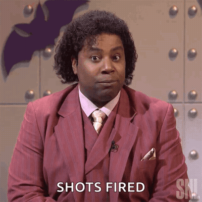 A Man In A Suit Says Shots Fired GIF