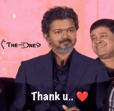A Man In A Suit Says " Thank U " With A Red Heart GIF