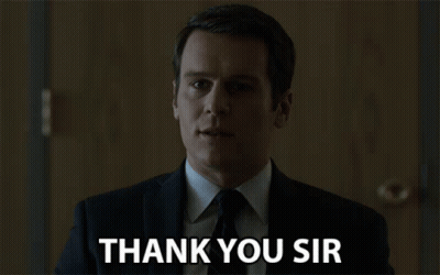 A Man In A Suit Says Thank You Sir In Front Of A Door GIF