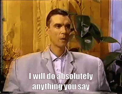 A Man In A Suit Says That He Will Do Absolutely Anything You Say GIF