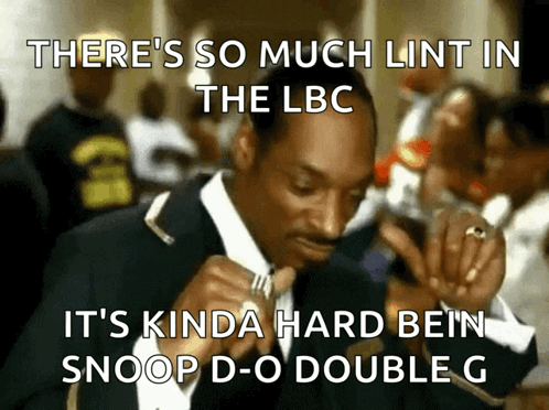 A Man In A Suit Says There 'S So Much Lint In The Lbc It 'S Kinda Hard Bein Snoop GIF