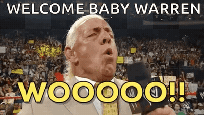 A Man In A Suit Says Welcome Baby Warren Woooo GIF