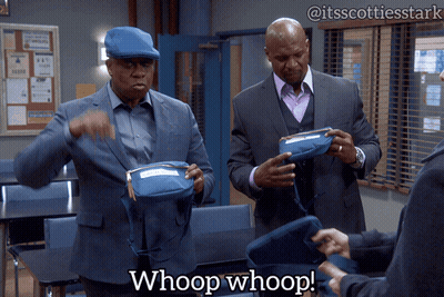 A Man In A Suit Says Whoop Whoop In A Classroom GIF