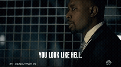 A Man In A Suit Says " You Look Like Hell " In Front Of A Nbc Logo GIF
