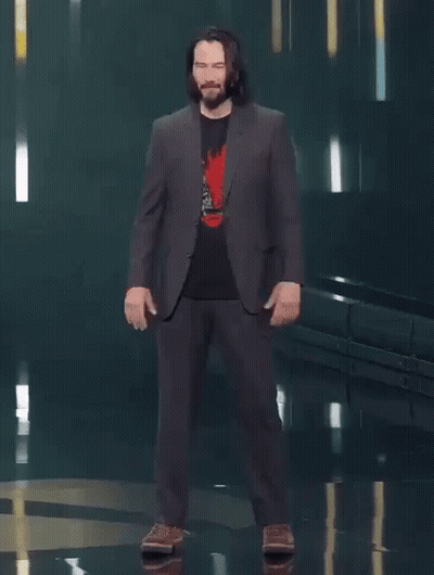 A Man In A Suit Says You 'Re Breathtaking While Standing On A Stage GIF