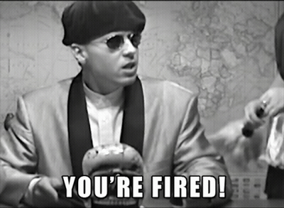 A Man In A Suit Says You 'Re Fired In A Black And White Photo GIF
