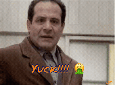 A Man In A Suit Says Yuck With A Smiley Face GIF