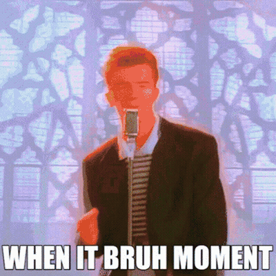 A Man In A Suit Singing Into A Microphone With The Words When It Bruh Moment Below Him GIF