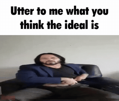 A Man In A Suit Sits On A Couch With The Words " Utter To Me What You Think The Ideal Is " Above Him GIF