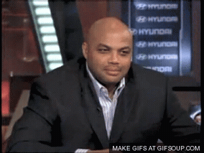 A Man In A Suit Sitting In Front Of A Hyundai Sign GIF