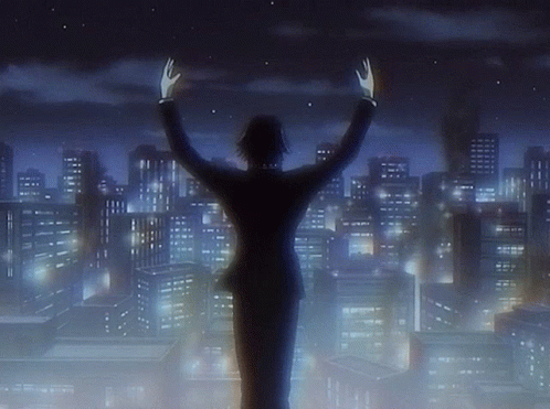 A Man In A Suit Stands In Front Of A City Skyline With His Hands In The Air GIF
