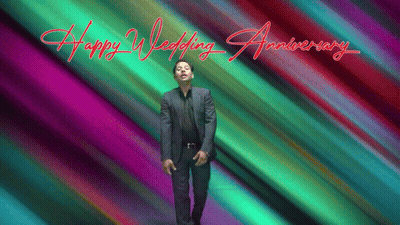 A Man In A Suit Stands In Front Of A Colorful Background That Says " Happy Wedding Anniversary " GIF