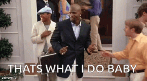 A Man In A Suit Stands In Front Of A Group Of People And Says " Thats What I Do Baby " GIF