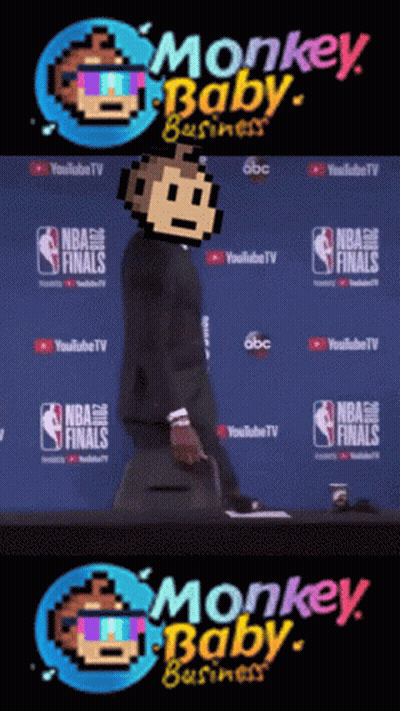 A Man In A Suit Stands In Front Of A Monkey Baby Business Logo GIF