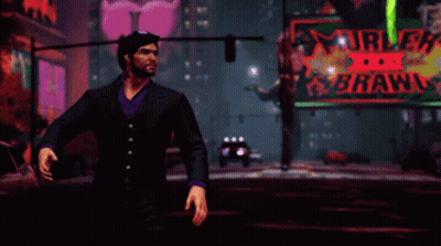 A Man In A Suit Stands In Front Of A Neon Sign That Says I Don T Make Threats GIF