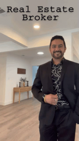 Man In Suit In Front Of Real Estate Broker Sign GIF