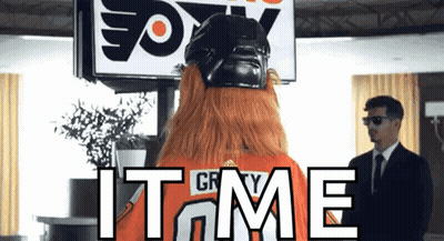 A Man In A Suit Stands In Front Of A Sign That Says " Fox " GIF