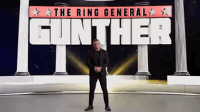A Man In A Suit Stands In Front Of A Sign That Says Gunther GIF