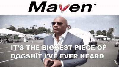 A Man In A Suit Stands In Front Of A Sign That Says " Maven " GIF