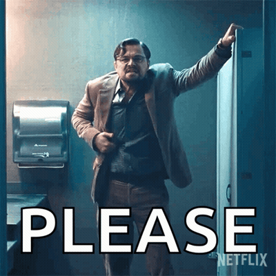 A Man In A Suit Stands In Front Of A Sign That Says Please On It GIF