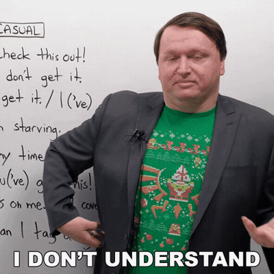 A Man In A Suit Stands In Front Of A White Board With Casual Written On It GIF