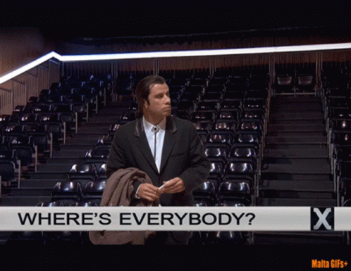 A Man In A Suit Stands In Front Of An Empty Auditorium With The Words Where 'S Everybody GIF