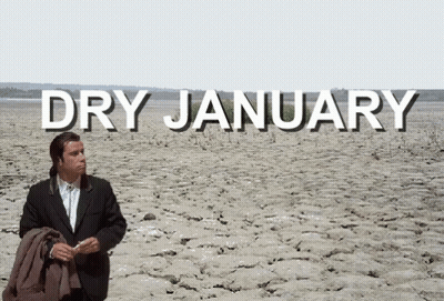 A Man In A Suit Stands In The Middle Of A Dry January GIF