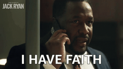 A Man In A Suit Talking On A Cell Phone With The Words I Have Faith Below Him GIF
