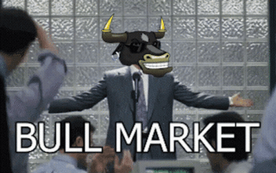 A Man In A Suit With A Bull On His Head Stands In Front Of A Group Of People With The Words Bull Market Behind Him GIF